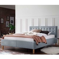 Stoffbett in Hellblau gestepptem Kopfteil